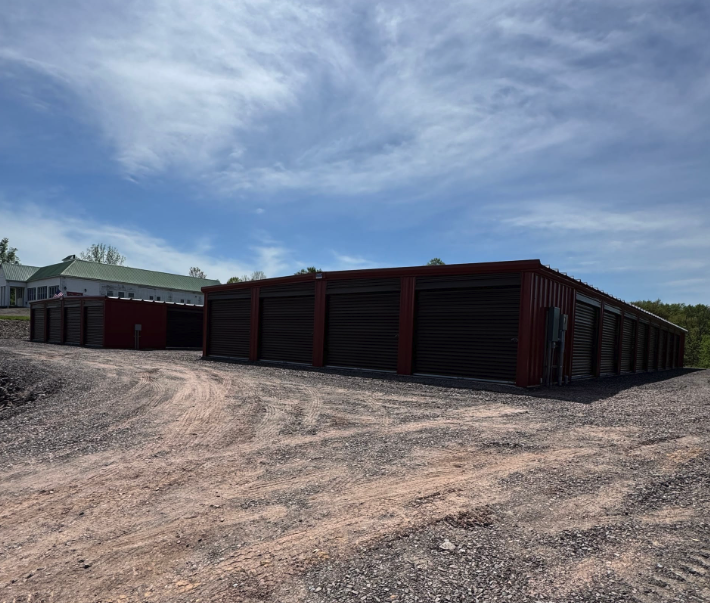 Wide view of Greystone Storage of Sweet Valley's drive-up storage units and office building